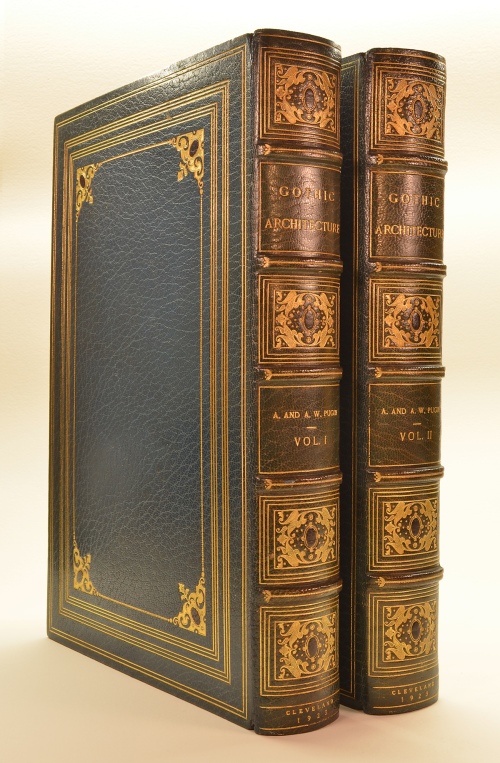 The Bindings are Deep Blue Crushed Morocco, with Onlays at the Board Corners and Spine Compartment of Black Morocco Ovals and Curls
