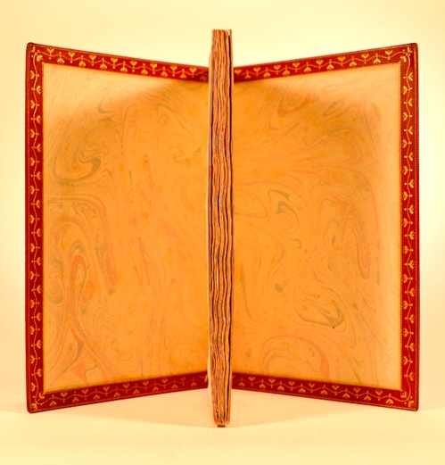 The Inner Boards, showing the leather turn-ins, with all the gilt decoration tooled separately.  The curving centerline 'vine' is made of semi-circle gouge tools a quarter inch long, applied end-to-end in alternating fashion.