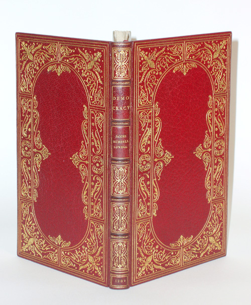 James Russell Lowell; "Democracy": Crimson Red Levant with Wide Gilt Panel Borders comprising  Floral Devices, Floral Fillets, and Pointille Work, Filling Six Compartments of straight and curved Double Ruling