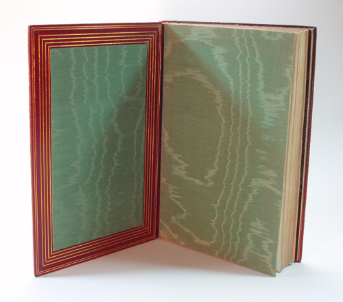 "The History of Art...." inner boards, with green watered (moire') silk endpapers and inset inner-board panels; wide dentelles with four widely-spaced gilt rules, and a further double-rule at board edges.